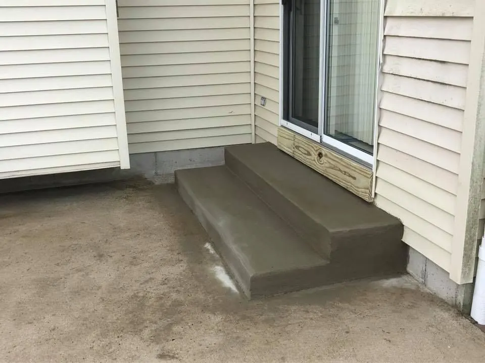 Concrete entry steps by J.D. James Construction